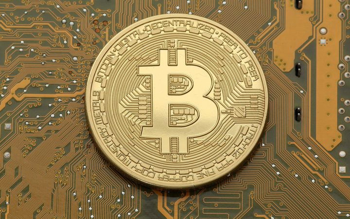 Bitcoin coin on a circuit board